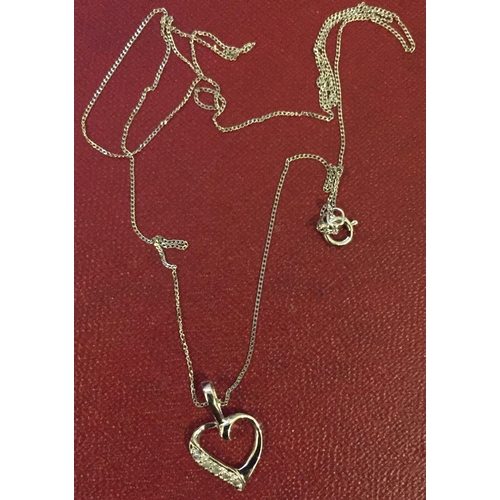 881 - A white gold heart pendant necklace. Weight approx. 0.8g