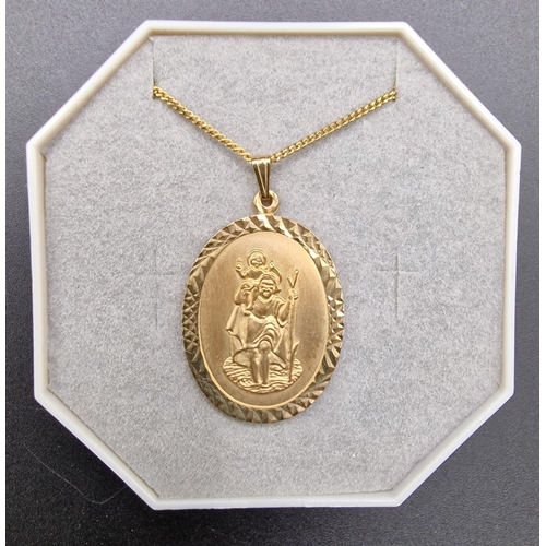 883 - A hallmarked, 9ct gold boxed St Christopher pendant. Birmingham assay. Maker's mark H-L. Weight appr... 