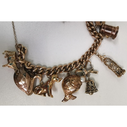 888 - A vintage 9ct gold charm bracelet. To include twelve individual charms. Each charm, chain & lock ful... 