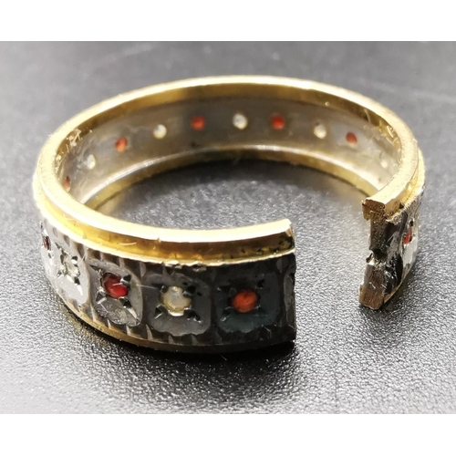 890 - A yellow metal ring (acid tests as 18ct Gold) decorated with a circle of small diamonds & rubies. Ri... 