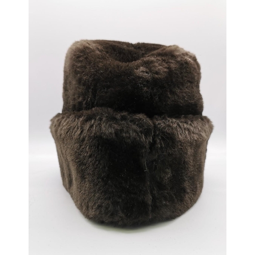 174 - A likely German, WWII Eastern front fur hat.