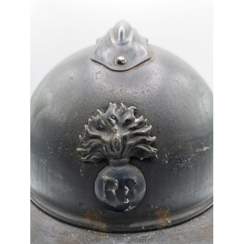 186 - A WWI French Infantry 'Adrian' helmet. An original, black helmet, stamped '58'. Complete with inner.