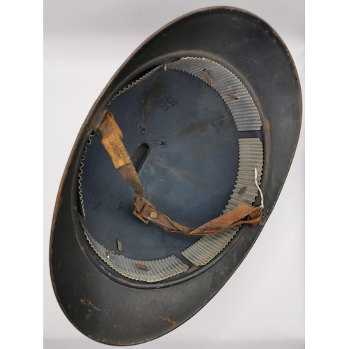 186 - A WWI French Infantry 'Adrian' helmet. An original, black helmet, stamped '58'. Complete with inner.