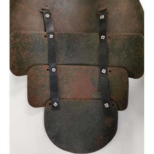 203 - A rare set of German WWI trench armour. Consists of a steel breast plate, with three additional inte... 