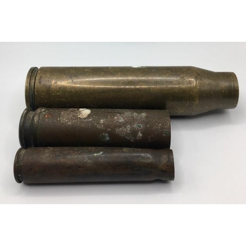 227 - A trio of spent brass shell cases.