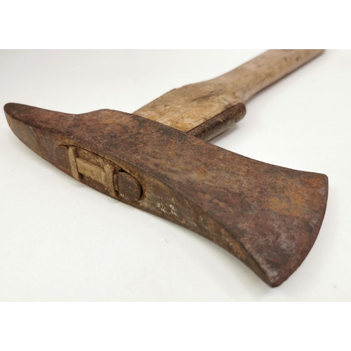 239 - A WWI German Pioneer Axe, with sheath. Length 38cm.