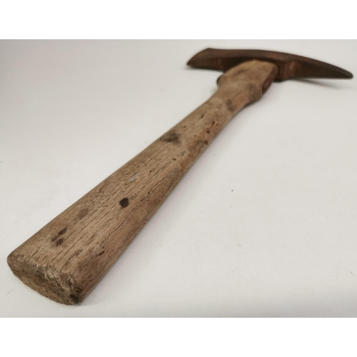 239 - A WWI German Pioneer Axe, with sheath. Length 38cm.