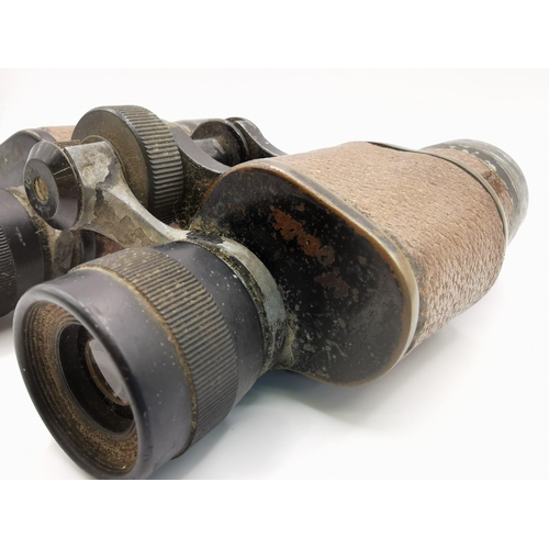 246 - A pair of leather-clad 10 x 30 WWII military binoculars, by 'Lumex'.