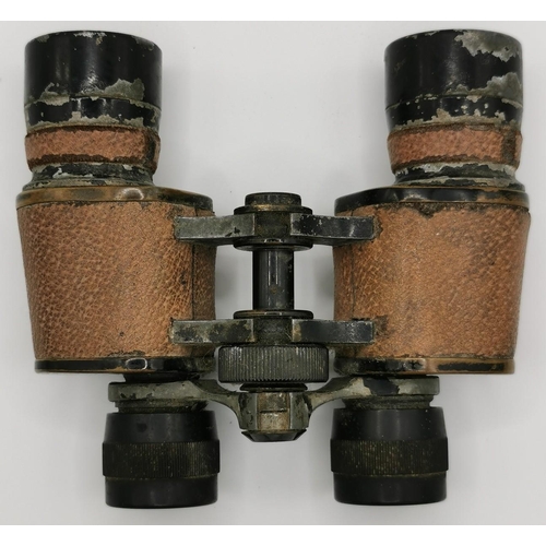 246 - A pair of leather-clad 10 x 30 WWII military binoculars, by 'Lumex'.