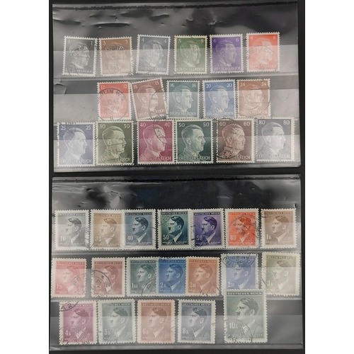 278 - A collection of thirty-six Adolf Hitler postage stamps, of various denominations, together with an e... 