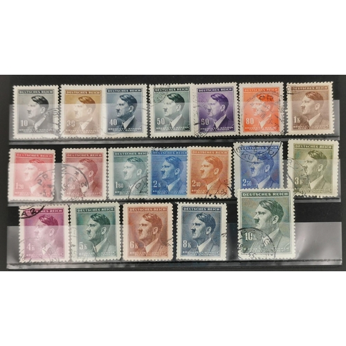 278 - A collection of thirty-six Adolf Hitler postage stamps, of various denominations, together with an e... 