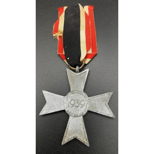 282 - A WWII German War Merit Cross & ribbon. A non-combatant example. The award was created in 1939 to re... 