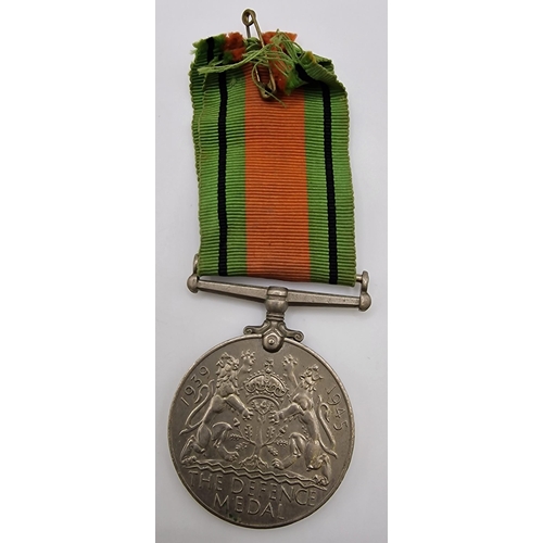 389 - A WWII Defence Medal, together with a cased Dep't of the Environment - Hampton Court bronze medallio... 