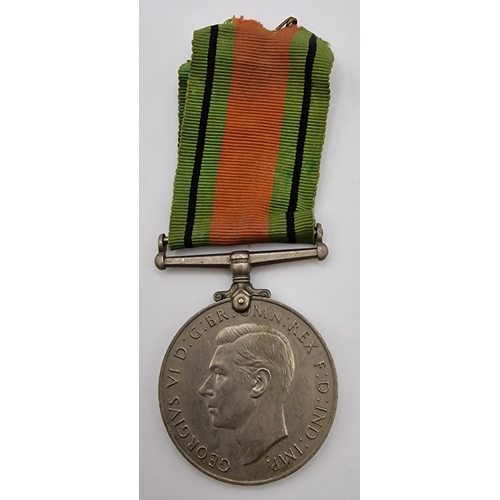 389 - A WWII Defence Medal, together with a cased Dep't of the Environment - Hampton Court bronze medallio... 