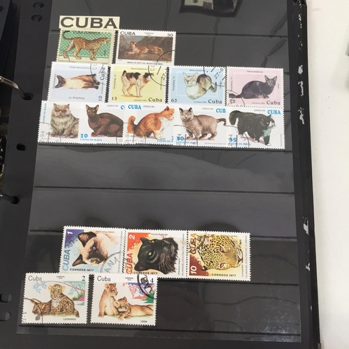 1626 - Two partially-completed stamp albums , with a 'Cats of the World' theme.