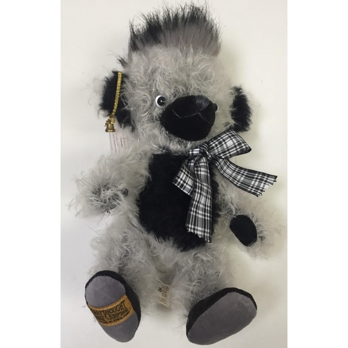 4056 - Merrythought 'Cheeky Punkie Sooty' bear. Black & white mohair, with tartan ribbon. Catalogue no. JP1... 