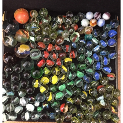 1811 - Approximately 175 early & mid-century glass marbles. Includes various colours & several larger examp... 