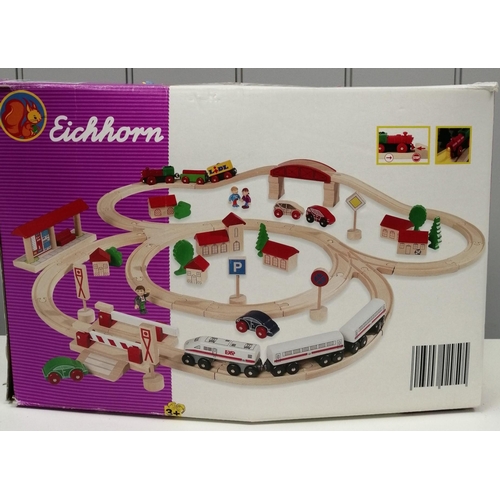 2701 - An 'Eichhorn' wooden starter train set. 88cm x 76cm when assembled. Contents unchecked, although app... 