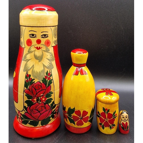 1826 - Two vintage Santa's. To include a Russian Matryoshka doll, with two presents & a child, together wit... 