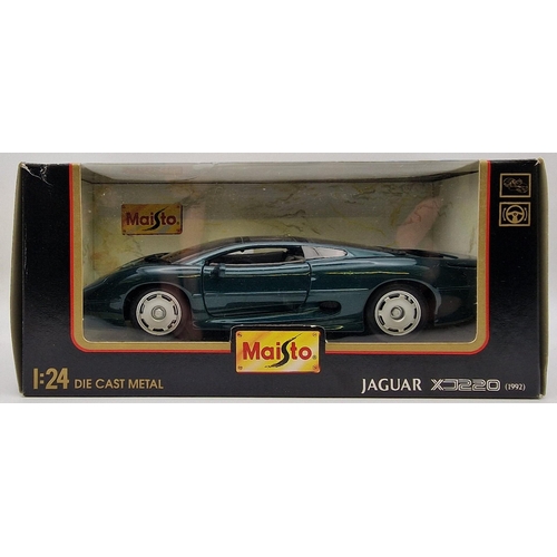 2173 - A collection of three boxed Maisto 1:24 scale  boxed cars. To include 1992 Jaguar Xj220, 1996 Jaguar... 