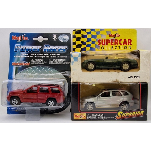 2176 - A collection of seven boxed/packaged vehicles by Solido & Maisto.