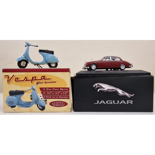 2166 - A collection of nine boxed diecast vehicles, by various manufacturers.