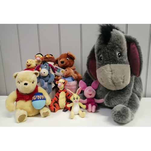 4081K - A collection of ten Winnie The Pooh soft toys. To include a very large Eeyore & Kanga with baby Roo ... 