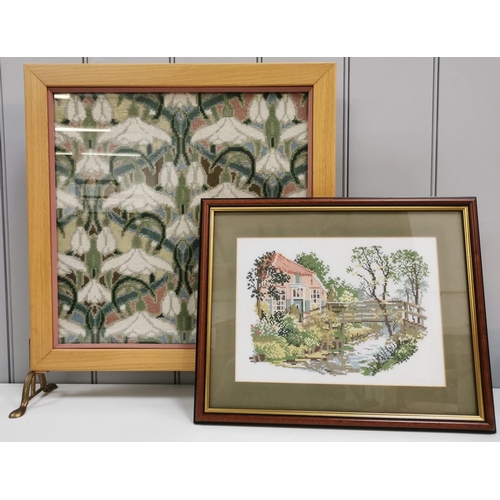 1 - A vintage glazed, cross-stitch fire screen, together with a framed country-scene cross-stitch. Respe... 