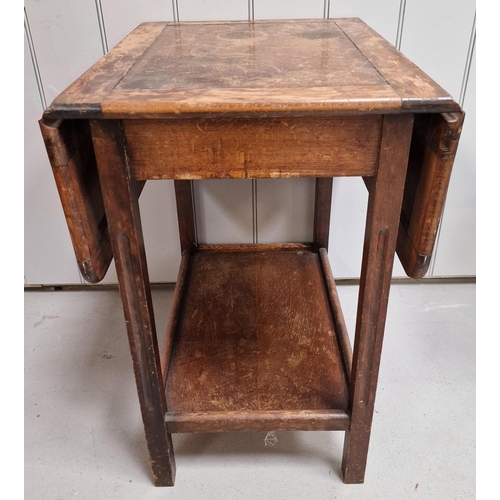 8 - An Edwardian oak, drop-leaf side table. Dimensions(cm) H68, W46/92, D60.