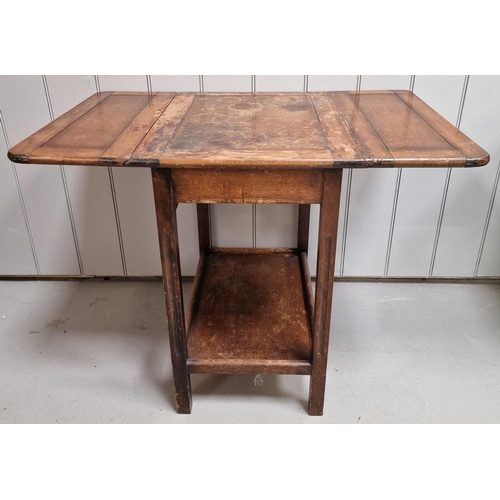 8 - An Edwardian oak, drop-leaf side table. Dimensions(cm) H68, W46/92, D60.