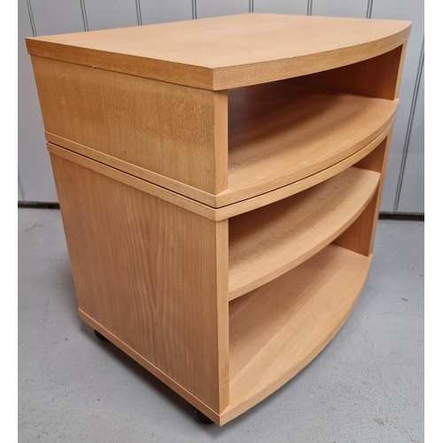 11 - A contemporary, beech-effect swivel-top TV/media stand. Dimensions(cm) H64, W60, D45.