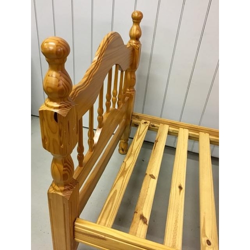 13 - A solid pine single bed frame, with slatted base. Largest dimensions(cm) H107, W103, L207.