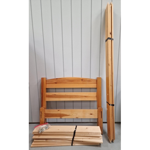 17 - A single Pine bed frame. Appears complete, with slats, fittings, headboard & footboard. Dimensions(c... 