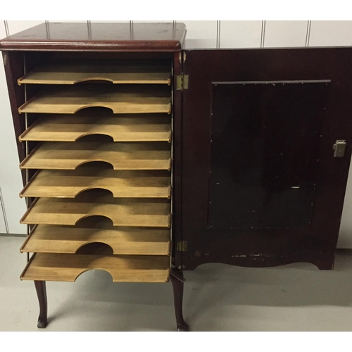 20 - A mahogany sheet music cabinet, with mirrored door detail. Dimensions(cm) H96, W48, D37.