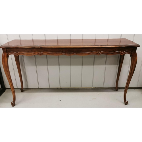 23 - A French Louis XV style, reproduction mahogany  console table. Dimensions(cm) H71, W136, D37.