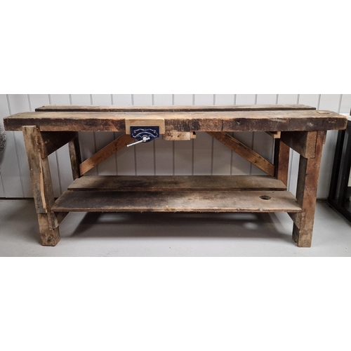 35 - A substantial, solid-wood workbench, with attached (later) vice. Dimensions(cm) H79, W184, D61.