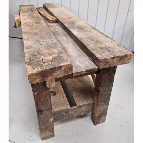 35 - A substantial, solid-wood workbench, with attached (later) vice. Dimensions(cm) H79, W184, D61.