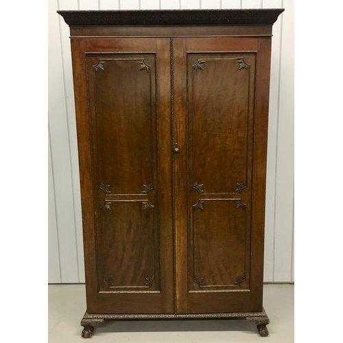 40 - A late 18th century/early 19th century mahogany double wardrobe. Separates into two halves, with bas... 