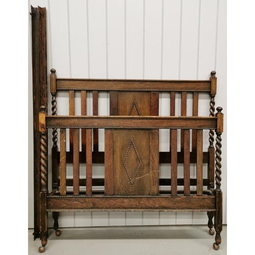 67 - An Edwardian oak bed frame. To include headboard, footboard & irons. Headboard 140cm x 138cm; footbo... 