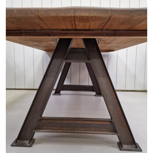 91 - An industrial-styled dining table. Rustic plank-topped, with weathered steel trestle supports. Dimen... 