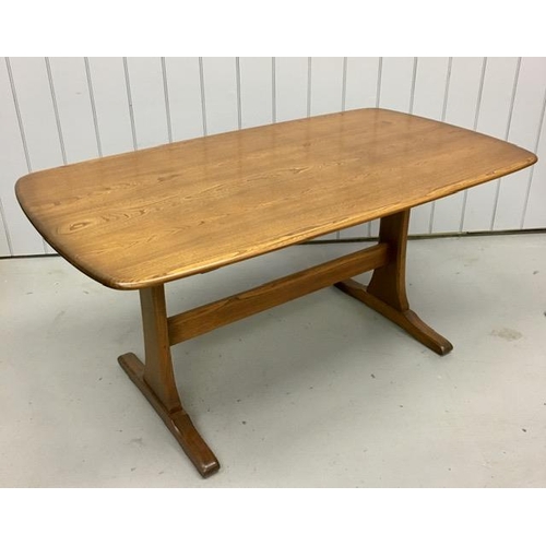 93 - An Ercol dark elm rectangular dining table. Dimensions(cm) H73, W153, D85.