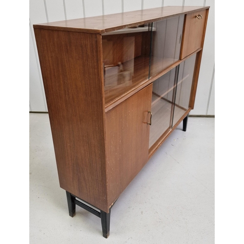 100 - An early 'Nathan' teak bookcase/cabinet, with two sets of glazed sliding doors. Dimensions(cm) H97, ... 