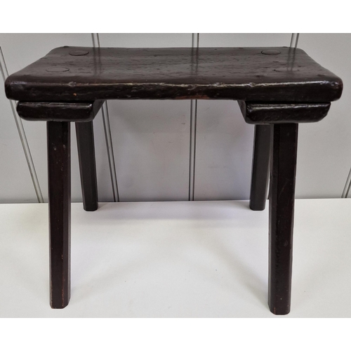 117 - A handmade, antique, four-legged milking stool. Dimensions(cm) H30, W36, D27.