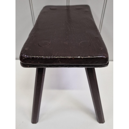 117 - A handmade, antique, four-legged milking stool. Dimensions(cm) H30, W36, D27.