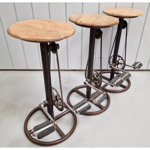 122 - A superb set of three 'bicycle pedal' kitchen stools. Each has a wooden seat, rustic steel base & (s... 