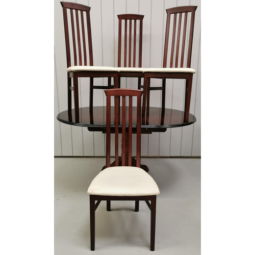 9 - An extending, cherry-coloured dining table, with four matching narrow slat-backed chairs, by 'Caxton... 