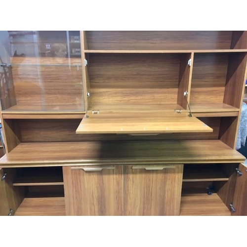 28 - A large teak display cabinet. Base features two double cupboards and would make a marvellous sideboa... 