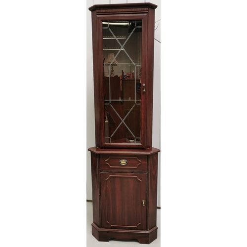 41A - A mahogany-effect corner cabinet. Glazed top with internal light & two glass shelves, over a single ... 