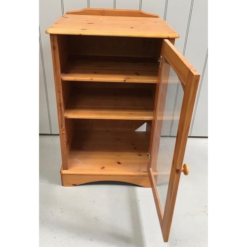 70 - A glazed, pine Hi-Fi cabinet, with two shelves. Dimensions(cm) H92, W58, D46.