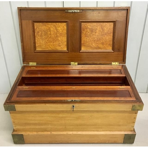 85 - A brass mounted, camphor military campaign chest. Hinged lid with walnut panels. Fully fitted interi... 